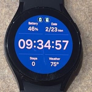 Samsung Black Smartwatch with Blue Watch Face